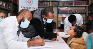 Volunteer dentists screen a child at Zewditu Meshesha Orphanage